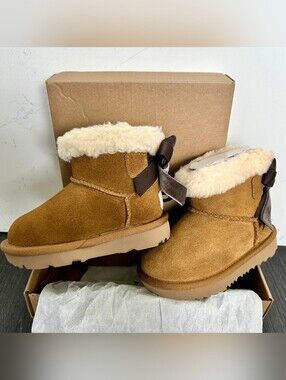 UGG Kids Chestnut Suede Booties with Cream Fur and Brown Bow